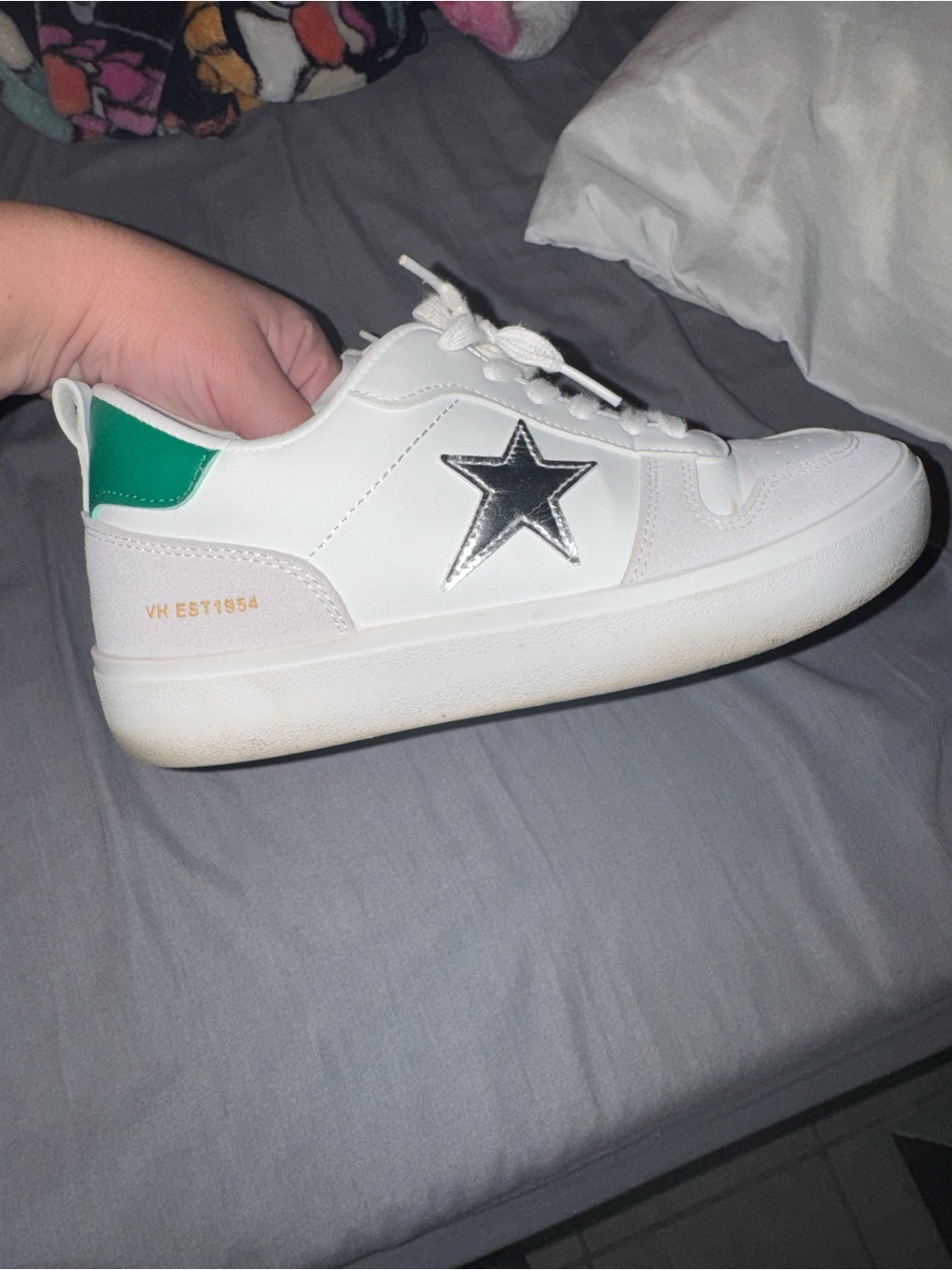 White Sneakers with Metallic Star Accent and Green Heel